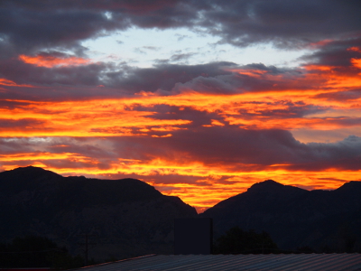 [Looks like the sky is on fire above the mountains. The yellow-orange is that bright.]